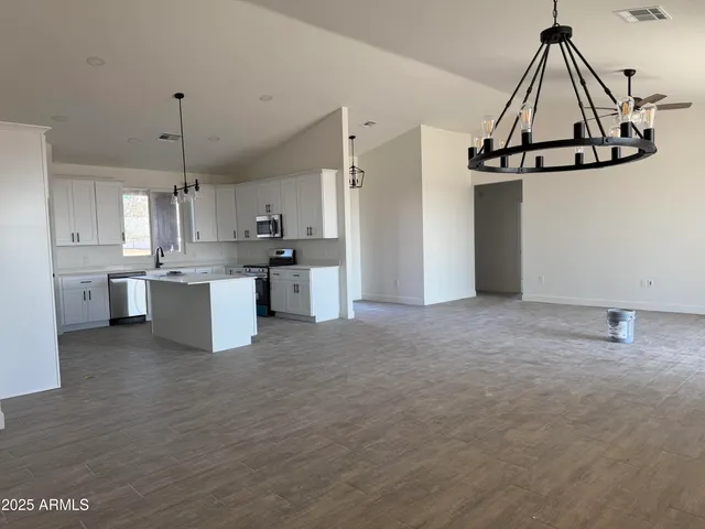 a view of a kitchen with electric appliances