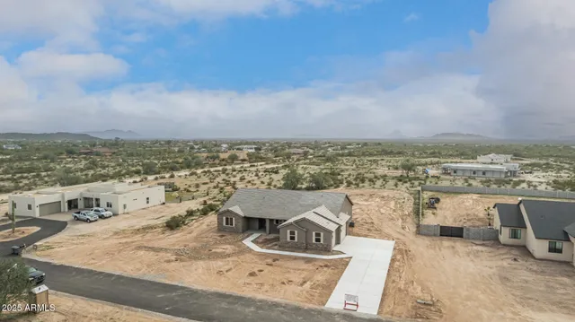 an aerial view of a house with beach