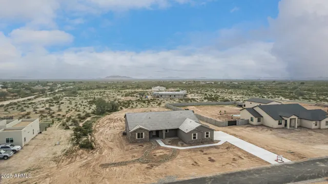 an aerial view of residential houses with outdoor space