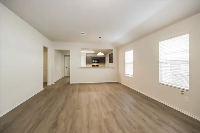 a view of a kitchen with a sink and dishwasher cabinets