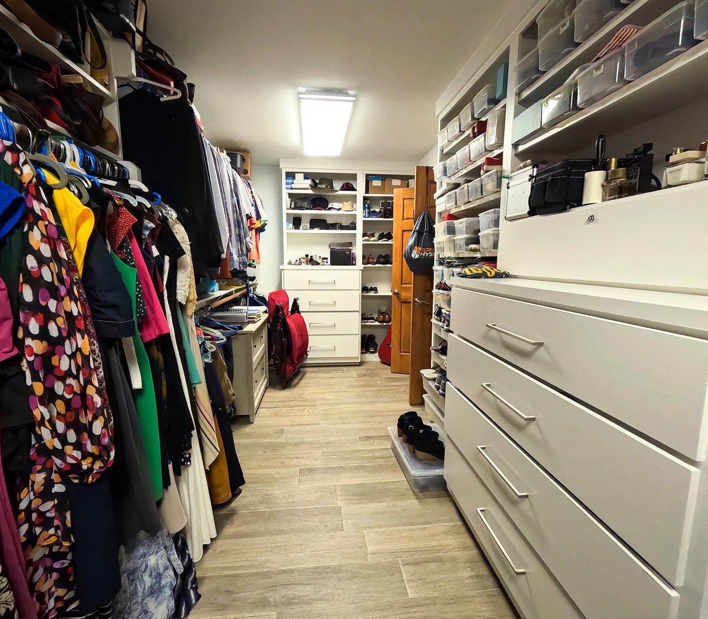 9818 Shadow Wood Drive Houston, TX 77080 - Photo 17 of 36 a view of walk in closet with clothes and shoes