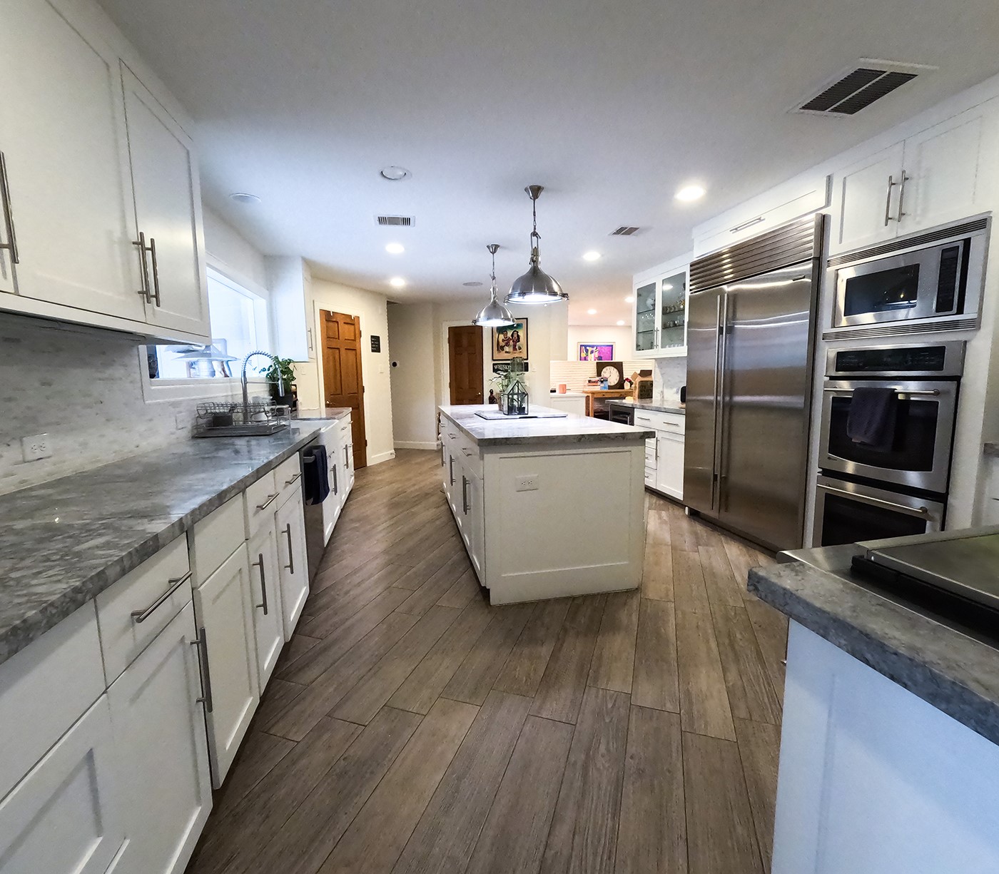 9818 Shadow Wood Drive Houston, TX 77080 - Photo 8 of 36 a kitchen with stainless steel appliances granite countertop a stove oven and a refrigerator