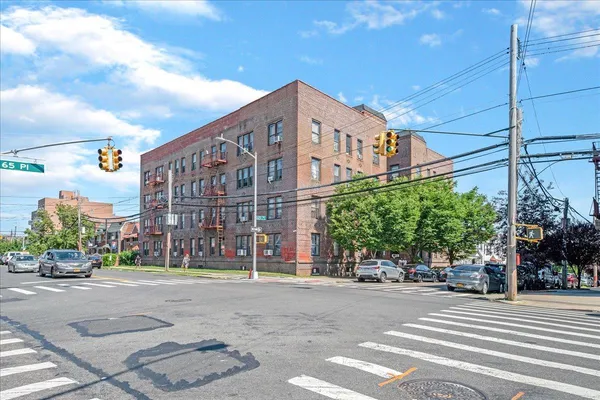 a view of a street with a building in the background