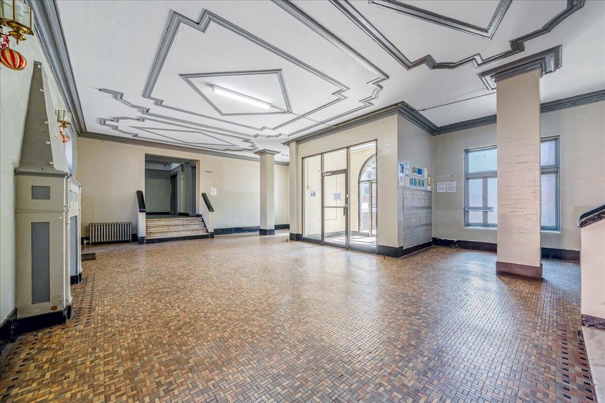 39-82 65th Place, Unit 4F Queens, NY 11377 - Photo 4 of 10 a view of empty room with wooden floor