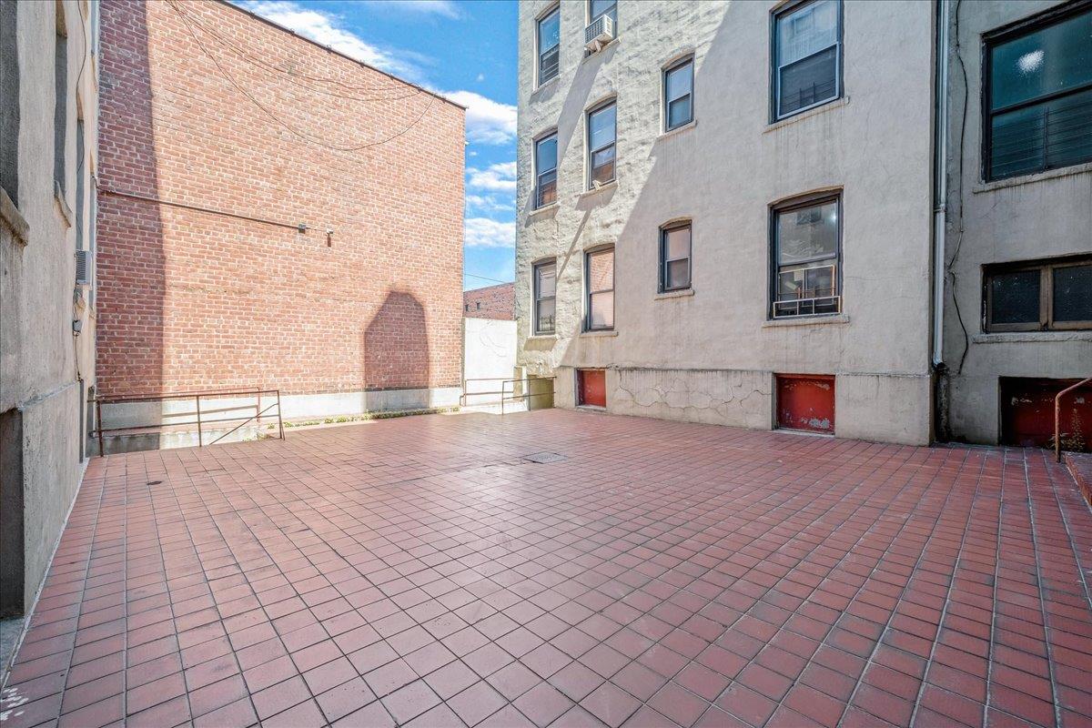 39-82 65th Place, Unit 4F Queens, NY 11377 - Photo 5 of 10 a view of empty room with windows