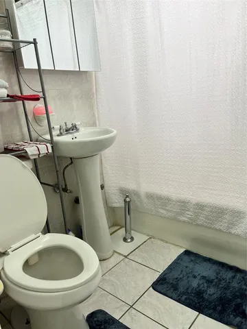 a bathroom with a sink and a toilet