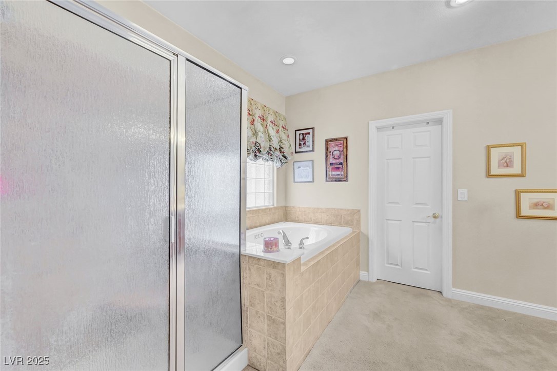 9725 Sandy Turtle Avenue Las Vegas, NV 89149 - Photo 31 of 51 Full bath featuring a stall shower, a bath, and recessed lighting