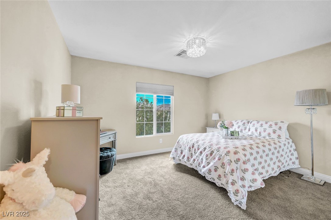9725 Sandy Turtle Avenue Las Vegas, NV 89149 - Photo 38 of 51 Bedroom with carpet flooring and baseboards