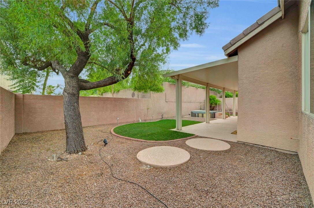 9725 Sandy Turtle Avenue Las Vegas, NV 89149 - Photo 49 of 51 Fenced backyard featuring a patio