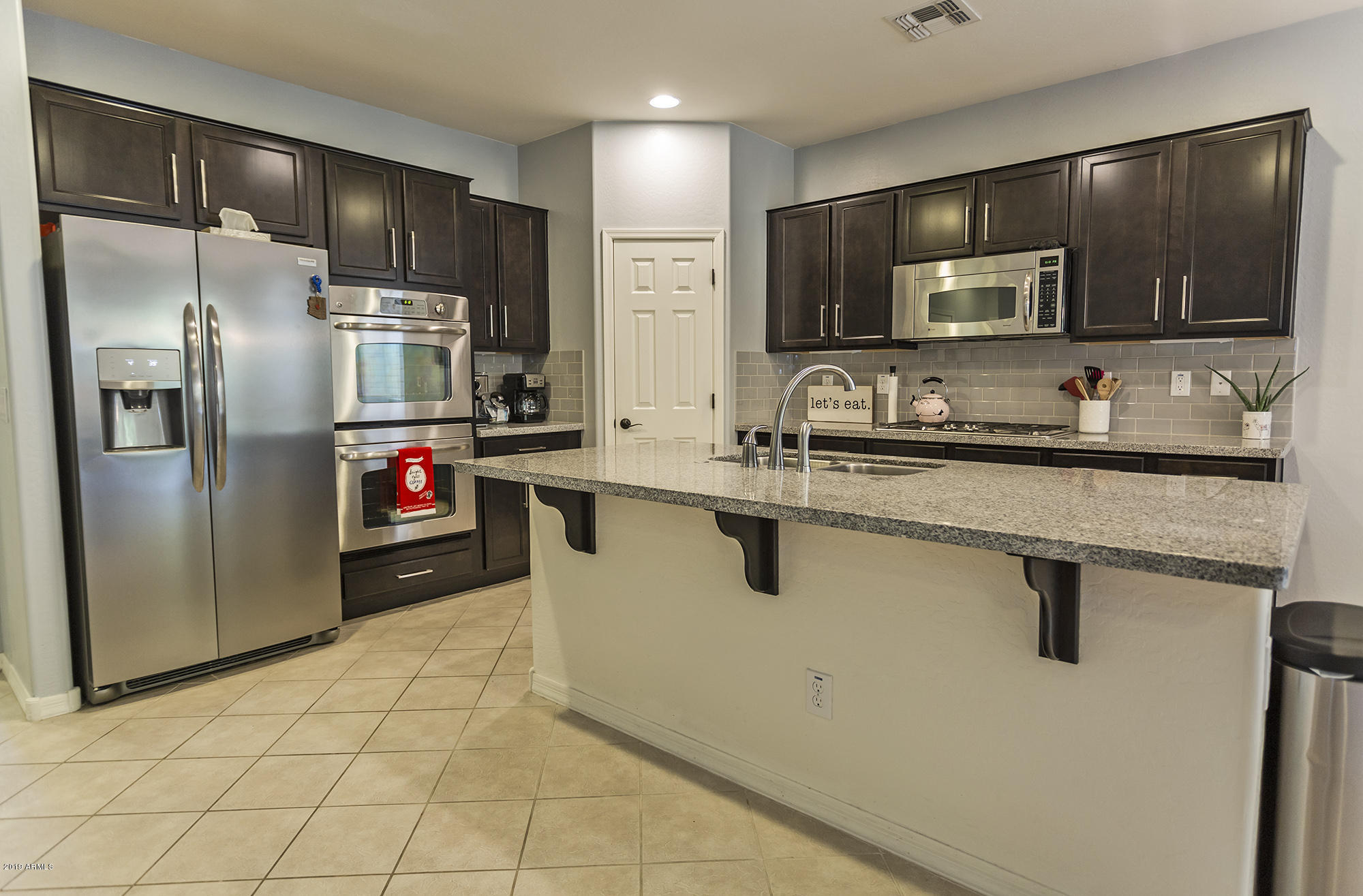 16128 West Almeria Road Goodyear, AZ 85395 - Photo 9 of 26 0T7A0167