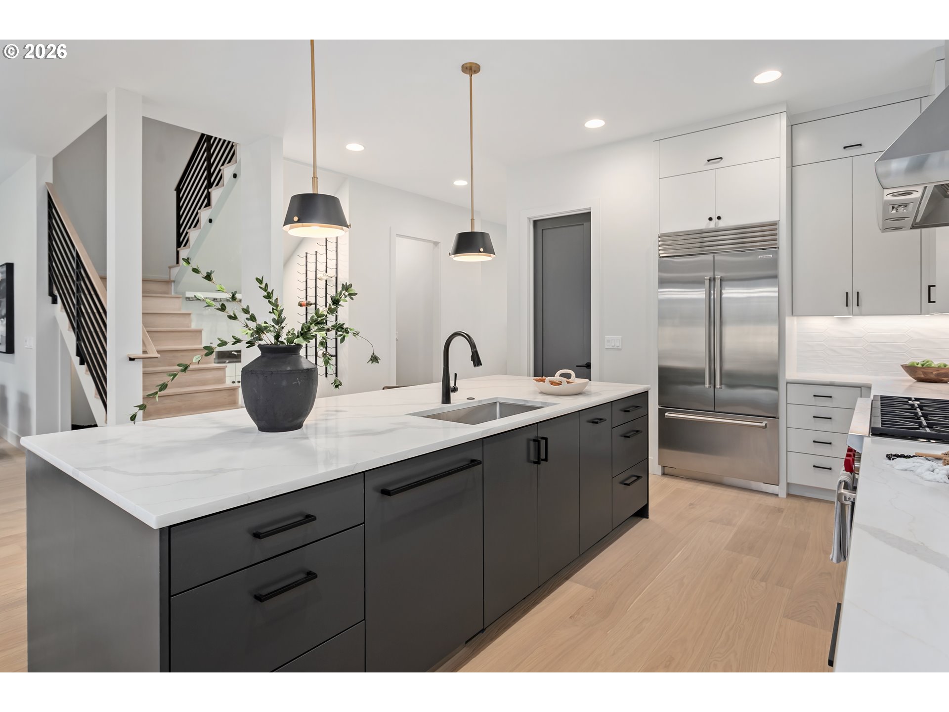 4977 Summit Street West Linn, OR 97068 - Photo 10 of 43 a kitchen with stainless steel appliances kitchen island a sink refrigerator and cabinets