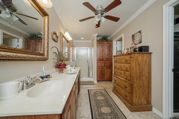 a bathroom with double vanity sink and a mirror