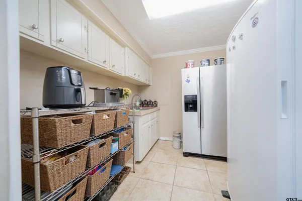 a kitchen with stainless steel appliances granite countertop a refrigerator and a stove