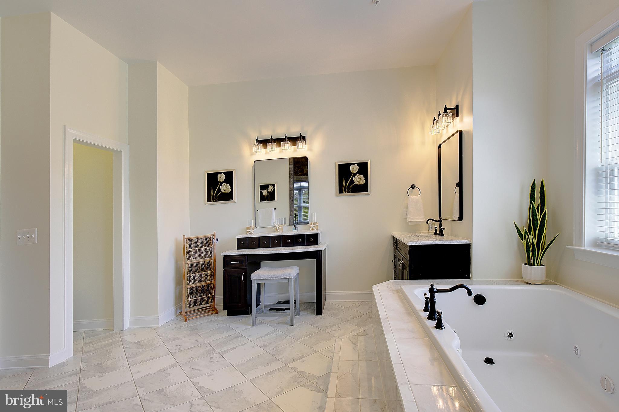 2393 Garrity Road St. Leonard, MD 20685 - Photo 34 of 76 Dual vanities and oversized soaking tub.