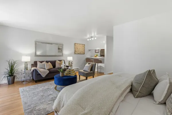 a bedroom with a bed and a couch