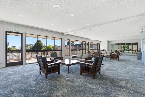a living room with furniture and a table