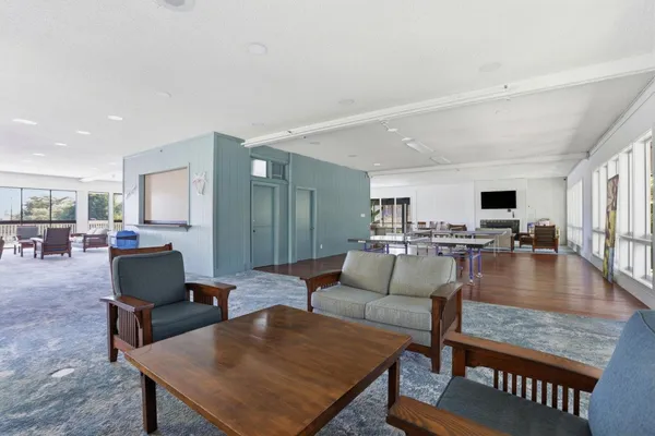 a room with wooden floor and furniture