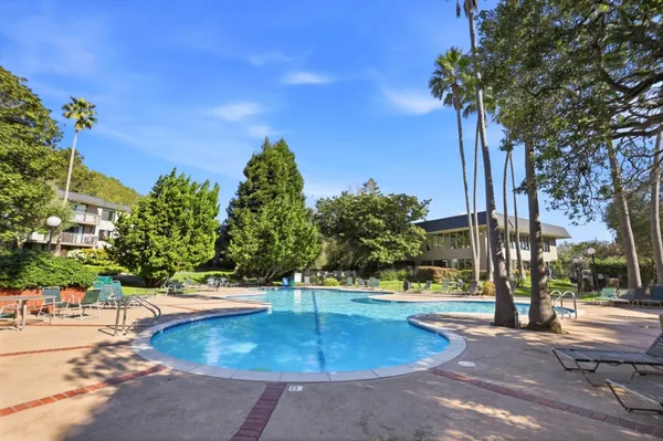 a view of a swimming pool with a patio