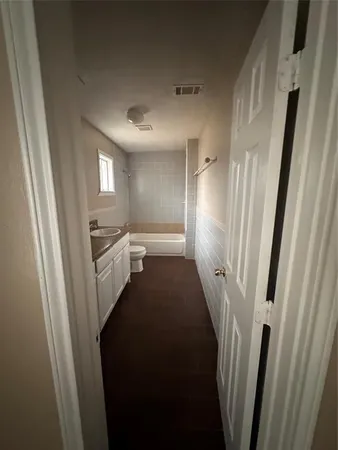 a view of a hallway with windows