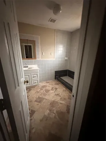 a bathroom with a toilet and a sink