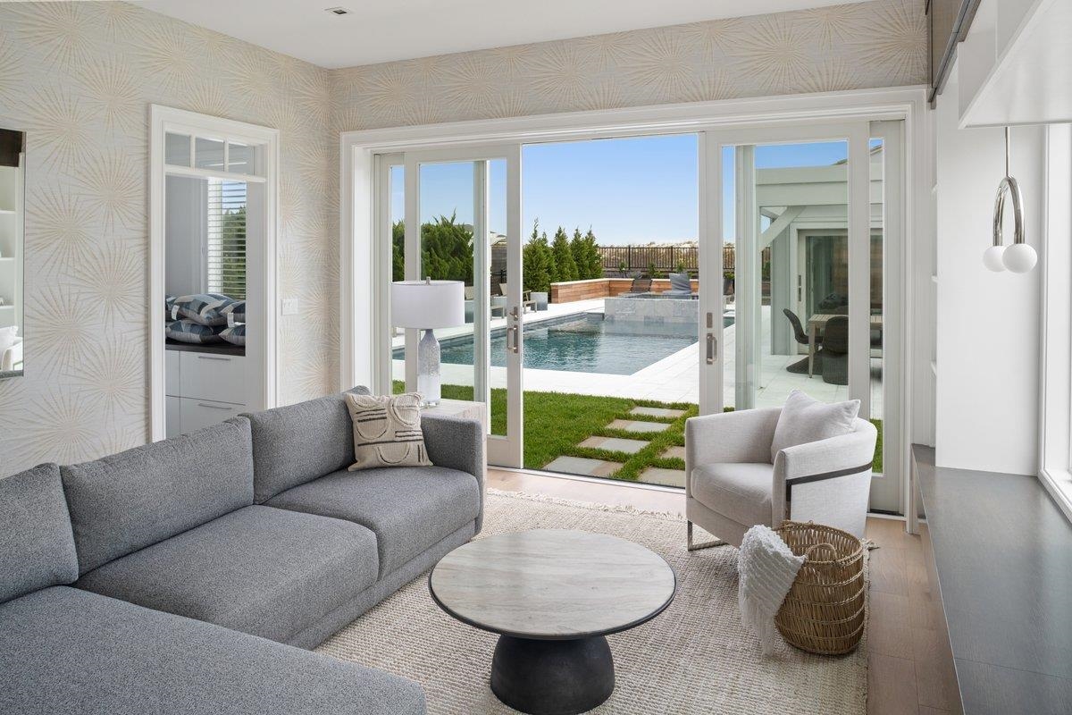 8808 1st Avenue Stone Harbor, NJ 08247 - Photo 13 of 49 a living room with furniture and a large window