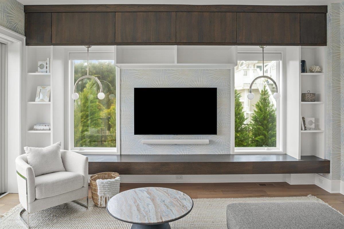 8808 1st Avenue Stone Harbor, NJ 08247 - Photo 14 of 49 a living room with a fireplace and a large window