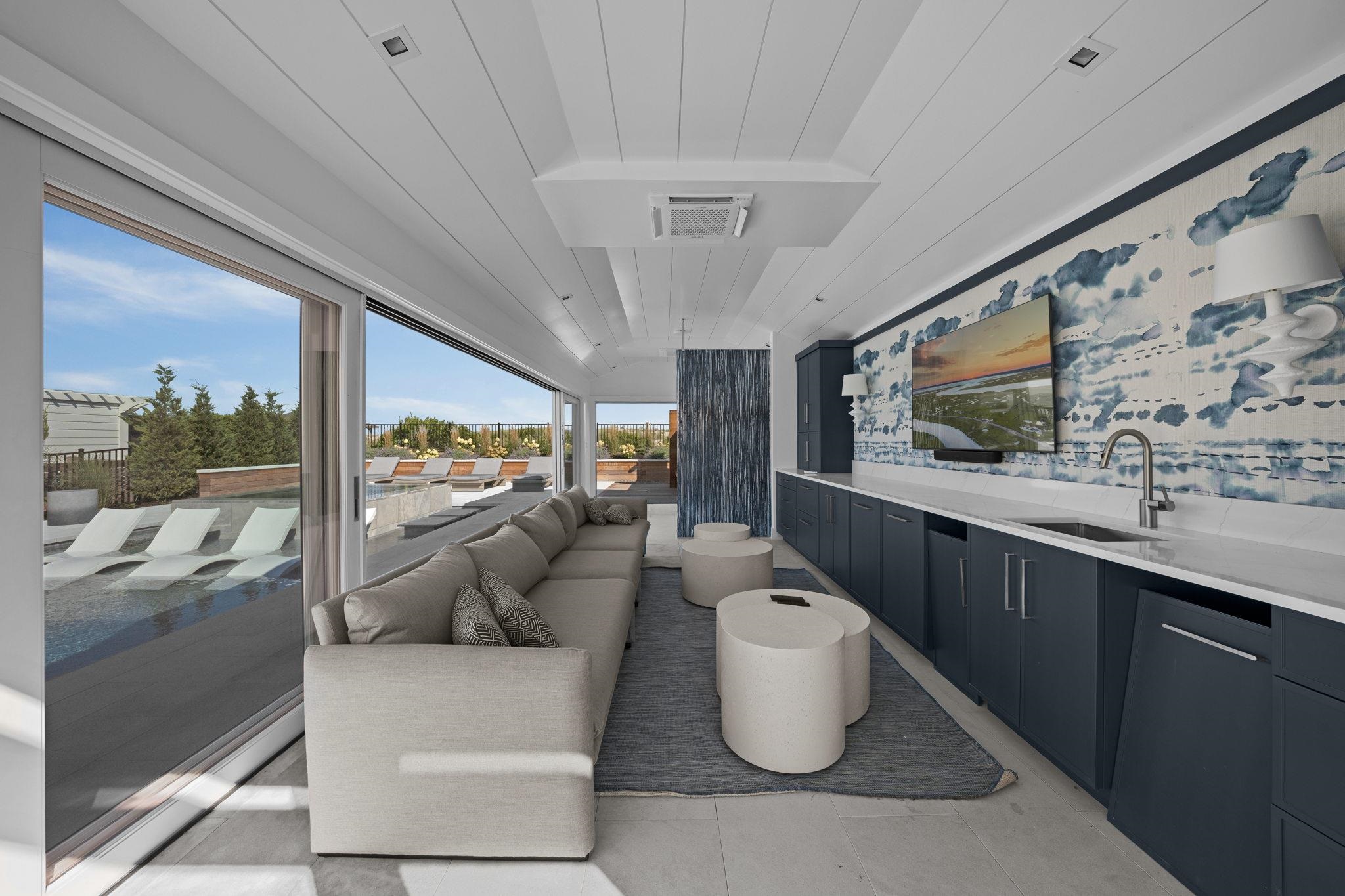 8808 1st Avenue Stone Harbor, NJ 08247 - Photo 20 of 49 a living room with furniture and a flat screen tv