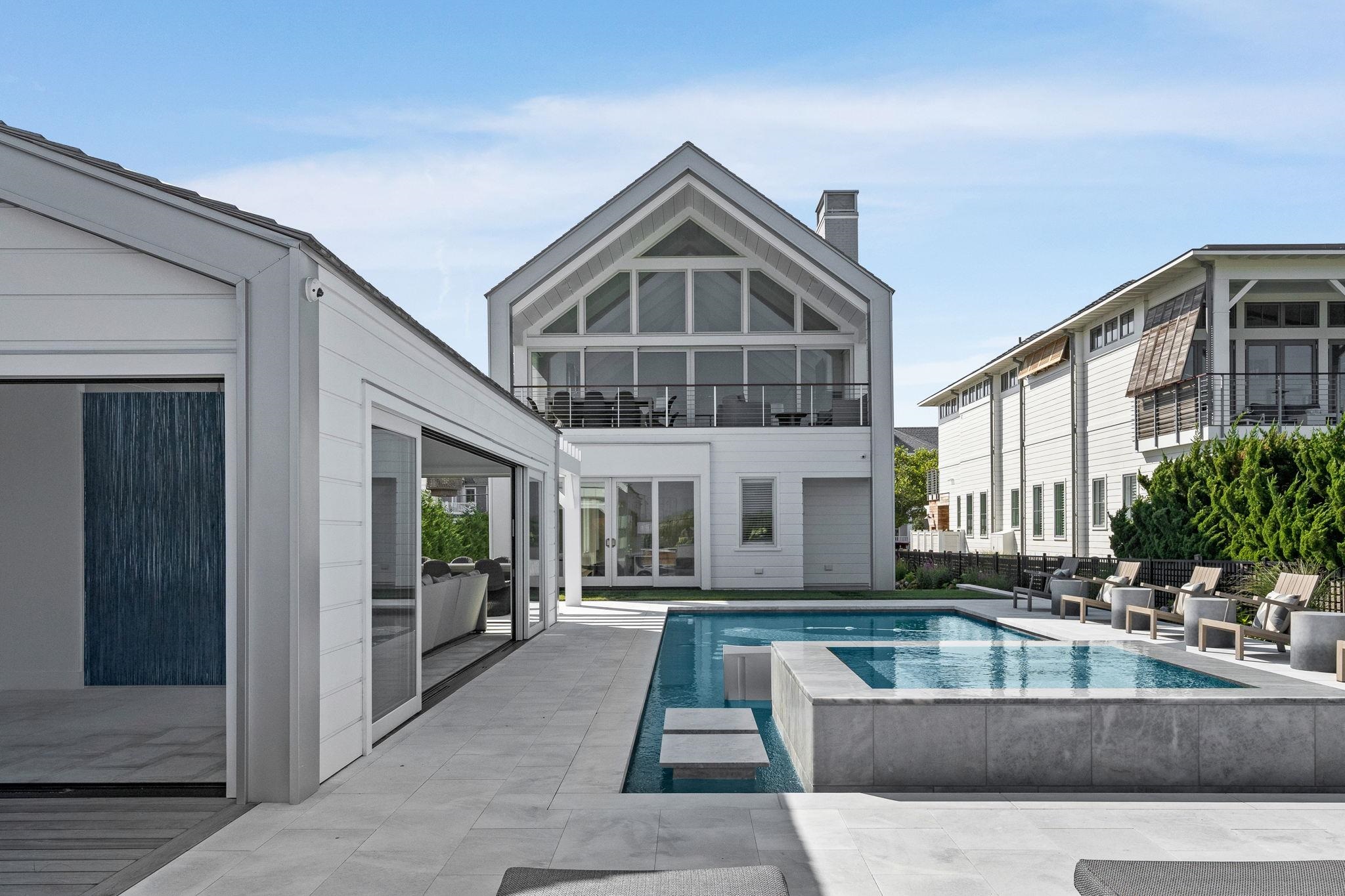 8808 1st Avenue Stone Harbor, NJ 08247 - Photo 2 of 49 a view of a house with couches and pool table