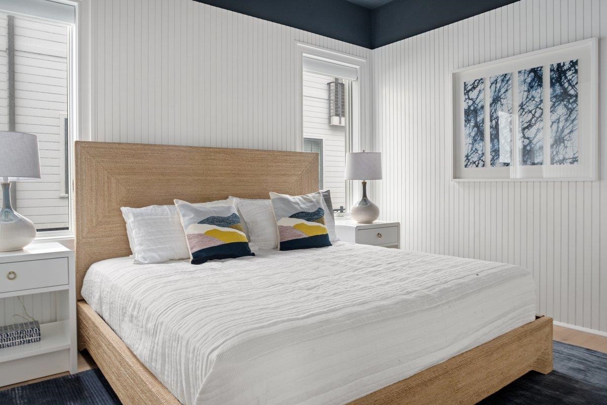 8808 1st Avenue Stone Harbor, NJ 08247 - Photo 34 of 49 a bedroom with a bed and lamp