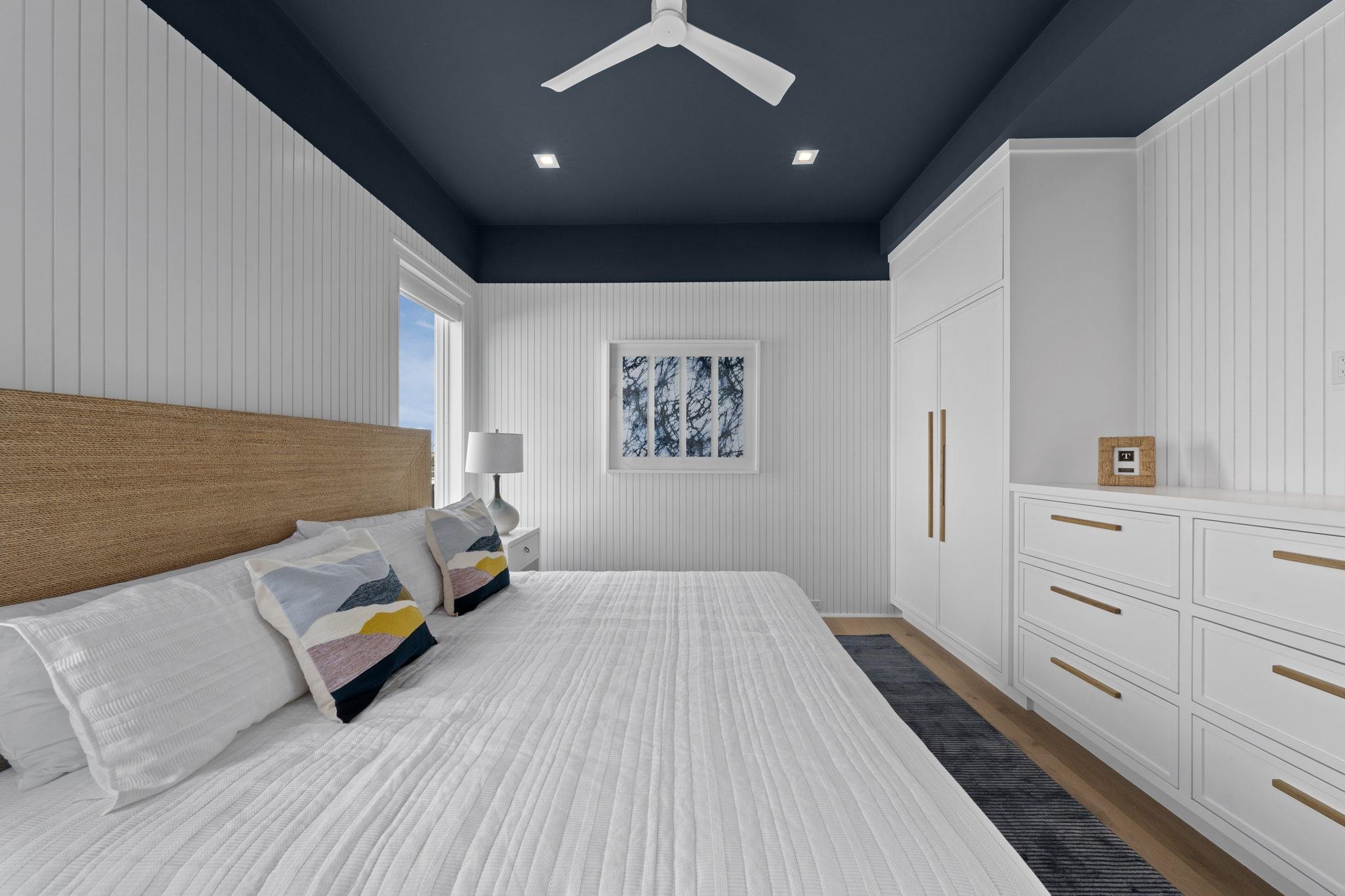 8808 1st Avenue Stone Harbor, NJ 08247 - Photo 35 of 49 a bed room with a bed and window