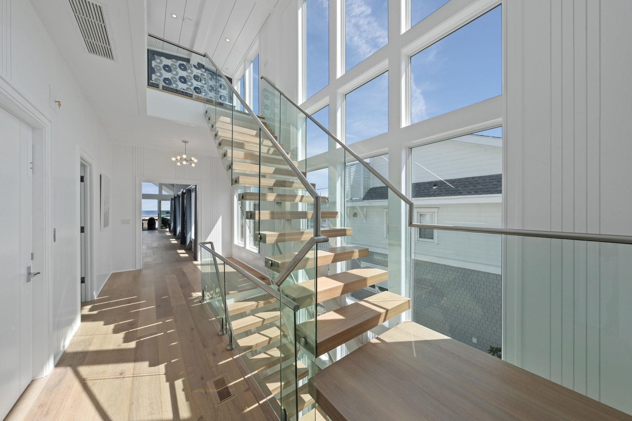 8808 1st Avenue Stone Harbor, NJ 08247 - Photo 37 of 49 a view of entryway and hall with wooden floor