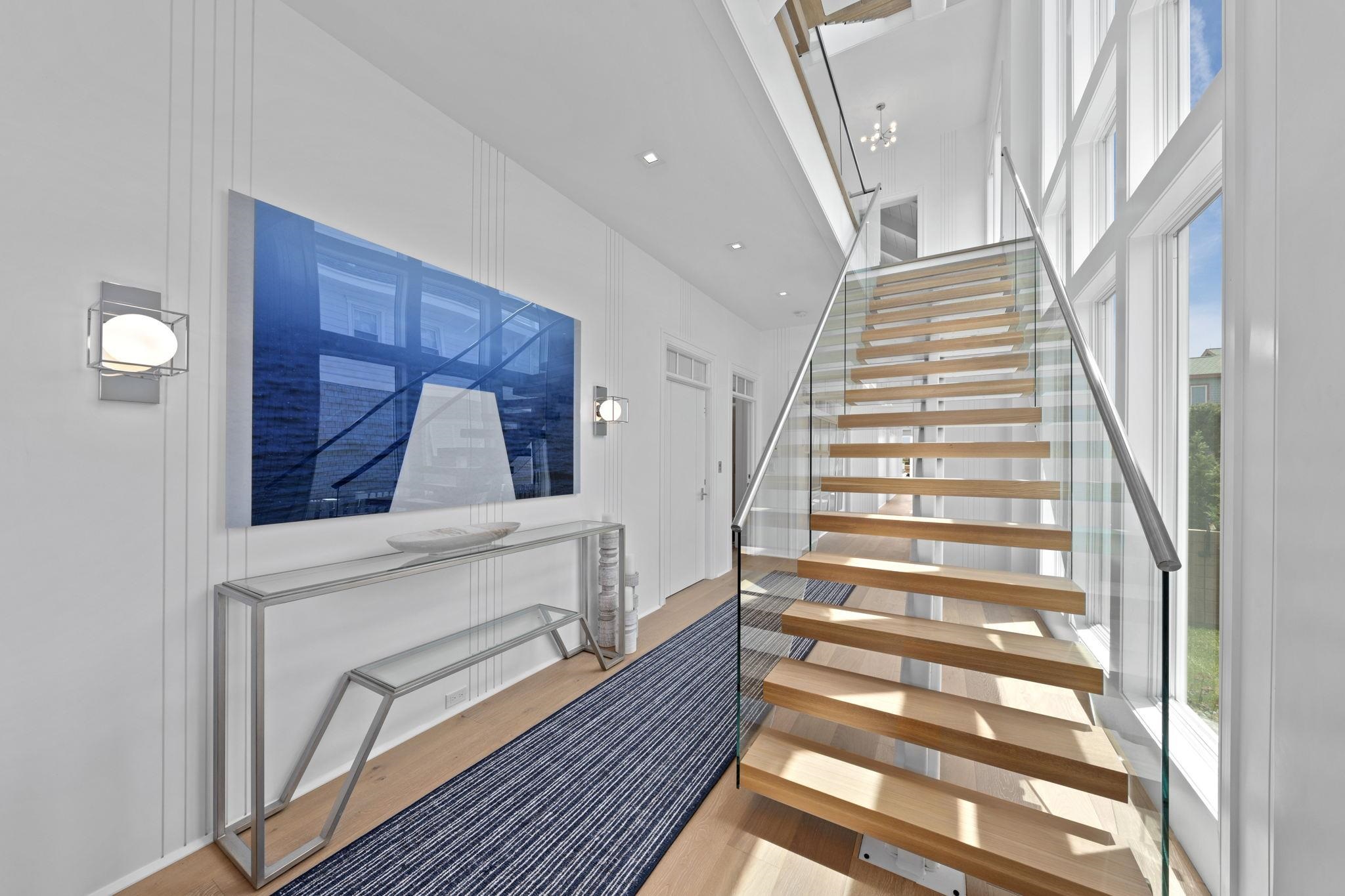 8808 1st Avenue Stone Harbor, NJ 08247 - Photo 4 of 49 a view of entryway and hall with wooden floor