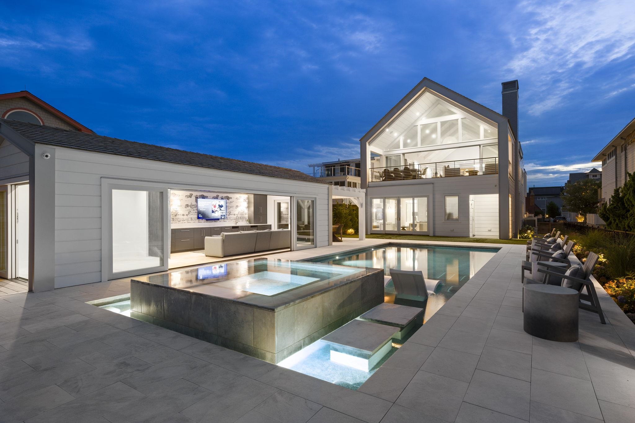 8808 1st Avenue Stone Harbor, NJ 08247 - Photo 44 of 49 a living room with furniture a fireplace and a flat screen tv