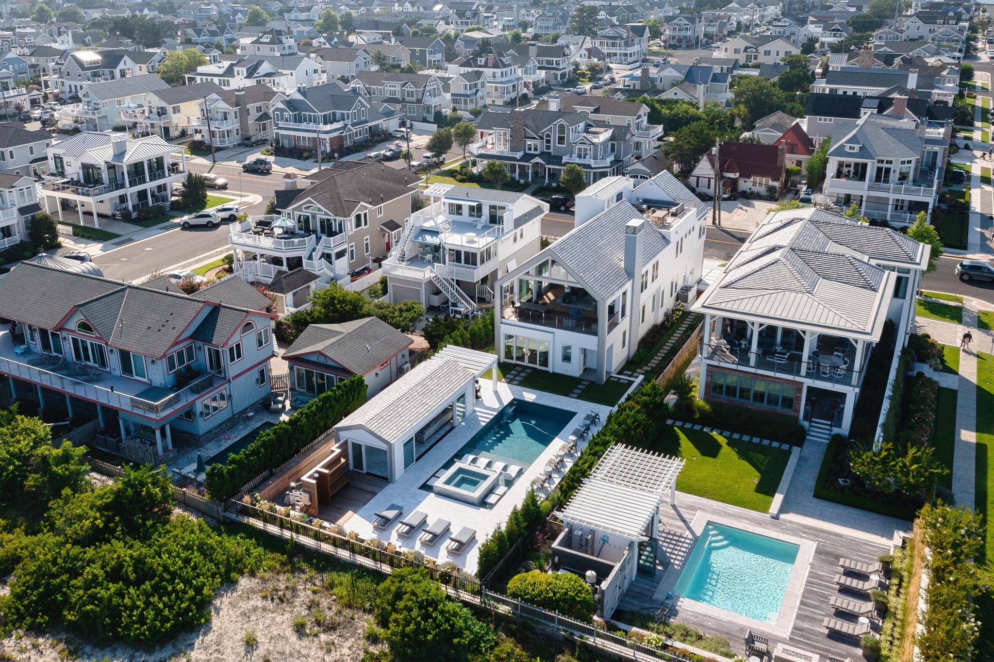 8808 1st Avenue Stone Harbor, NJ 08247 - Photo 49 of 49 an aerial view of multiple houses with yard