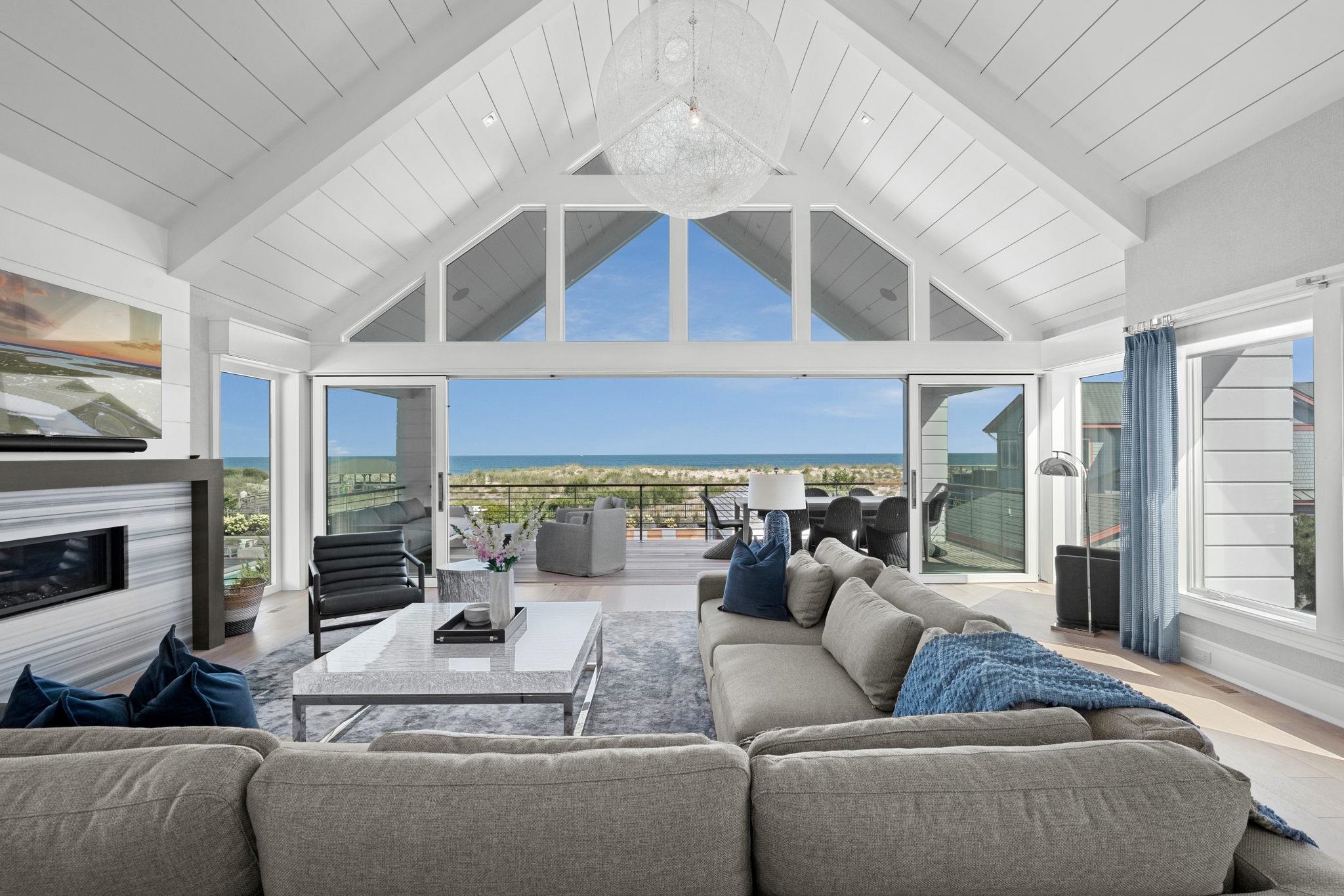 8808 1st Avenue Stone Harbor, NJ 08247 - Photo 5 of 49 a living room with furniture and a fireplace