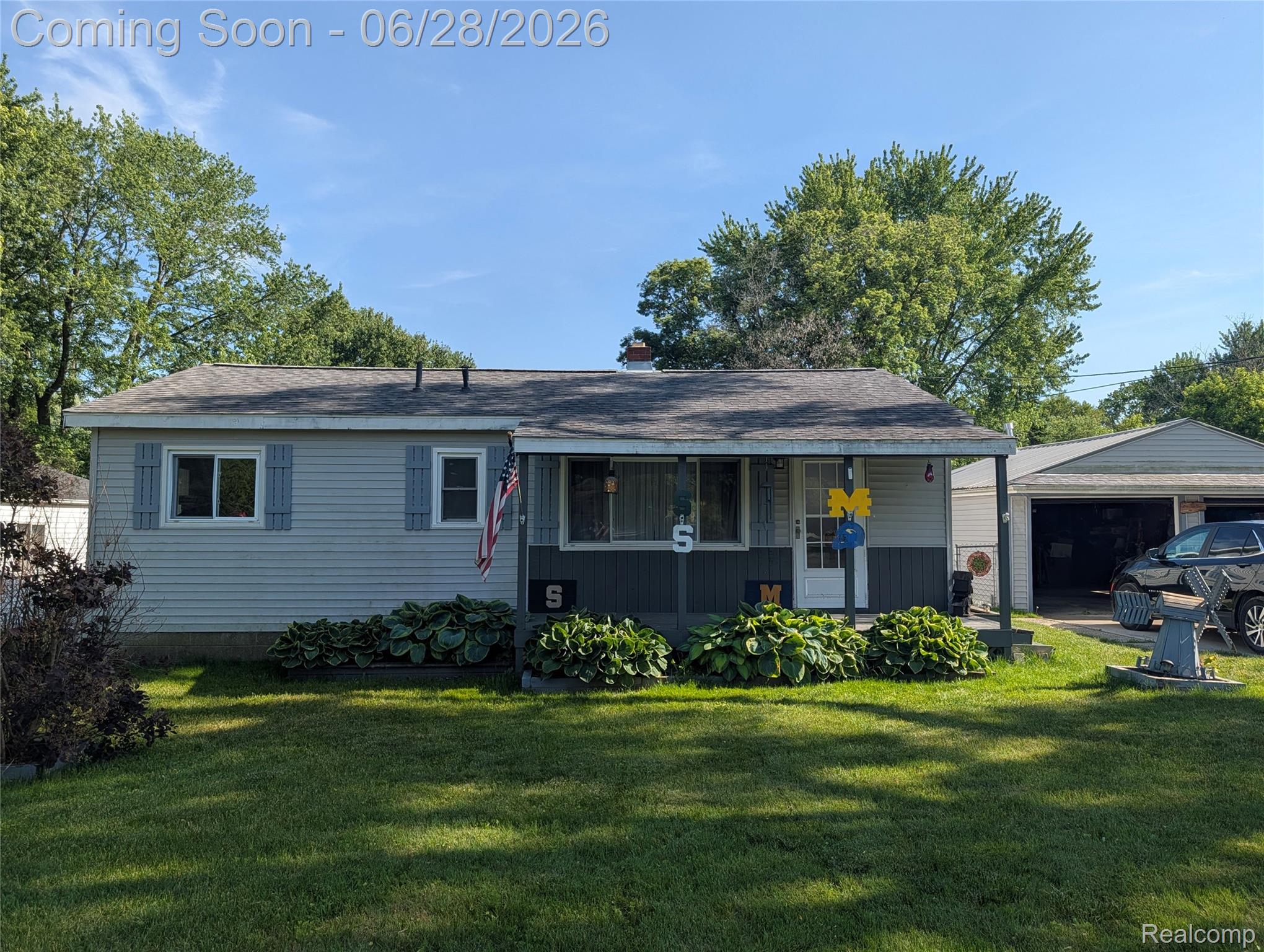 4456 East Coldwater Road Flint, MI 48506 - Photo 19 of 35 Ranch-style exterior with light gray siding and contrasting dark gray lower facade