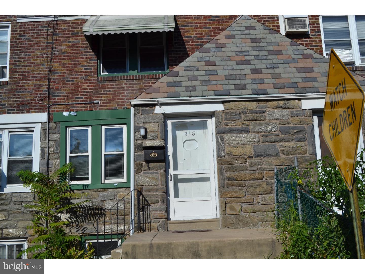 518 Timberlake Road Upper Darby, PA 19082 - Photo 1 of 21 a brick building with a door and a front door