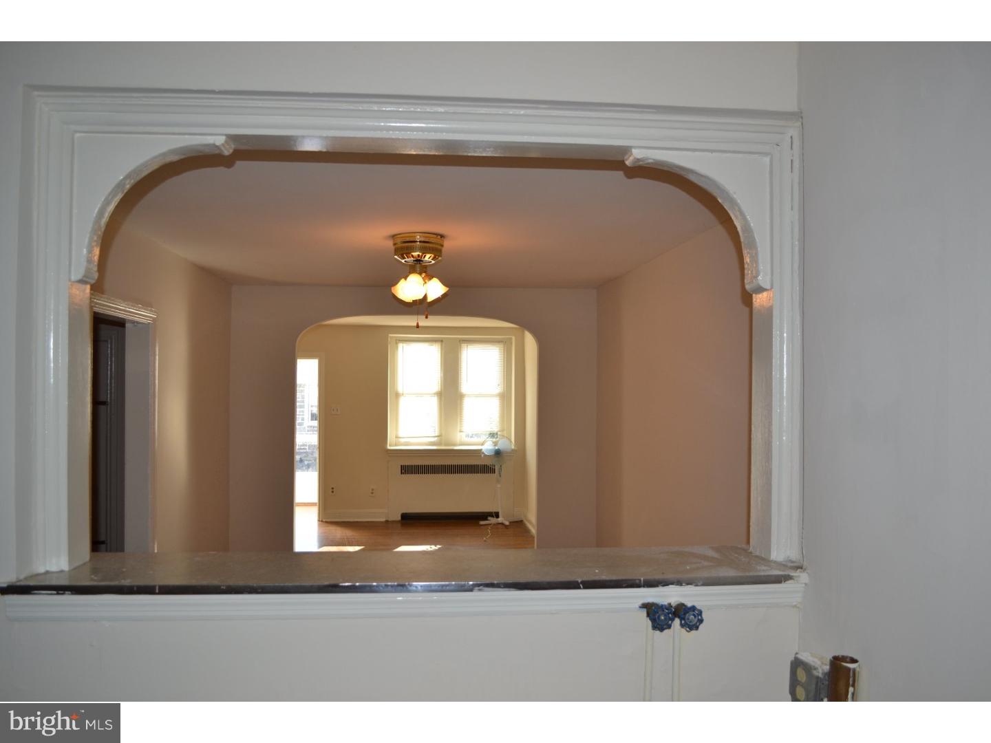 518 Timberlake Road Upper Darby, PA 19082 - Photo 4 of 21 a view of a livingroom with wooden floor and bench