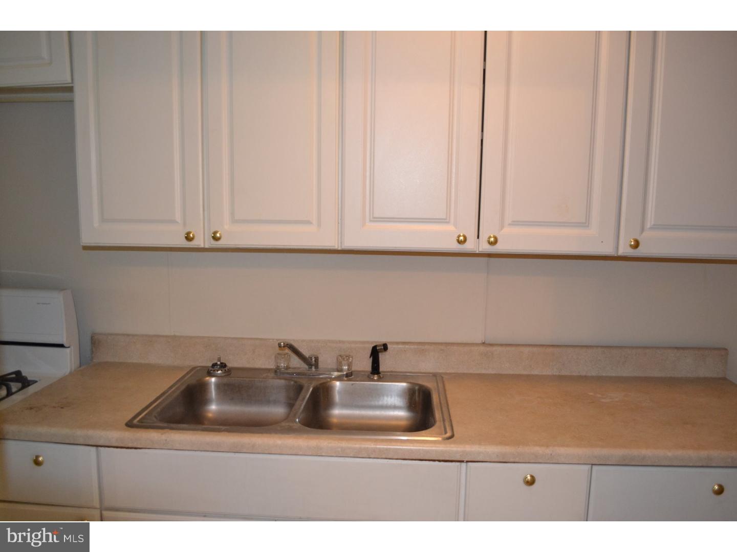 518 Timberlake Road Upper Darby, PA 19082 - Photo 7 of 21 a kitchen with a sink and cabinets