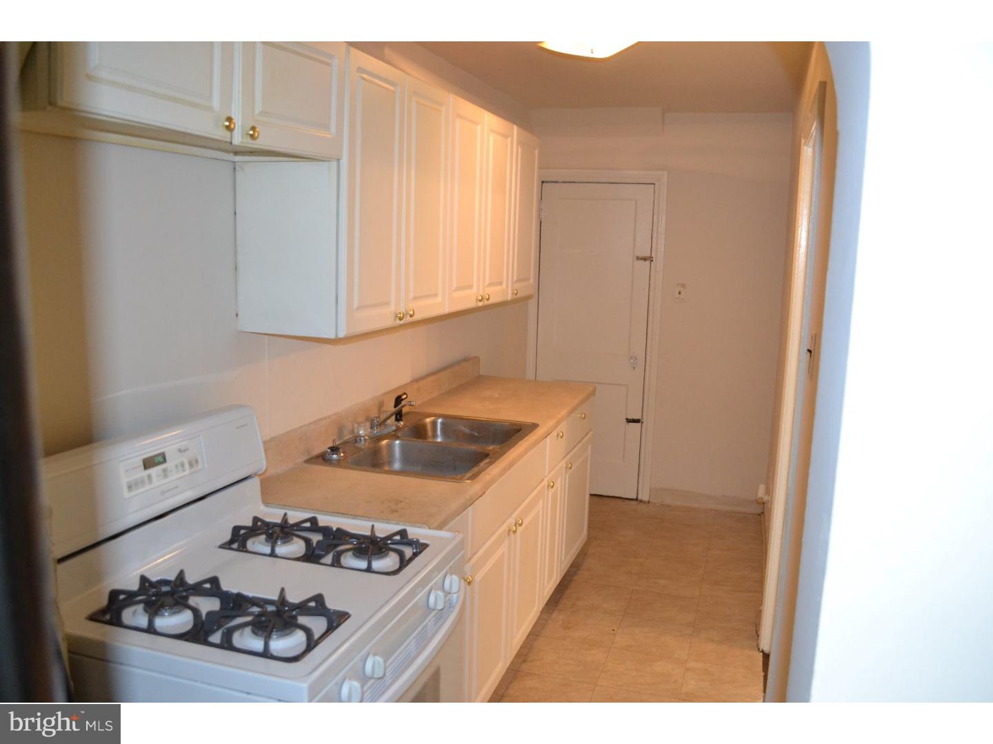 518 Timberlake Road Upper Darby, PA 19082 - Photo 9 of 21 a kitchen that has a sink stove and cabinets
