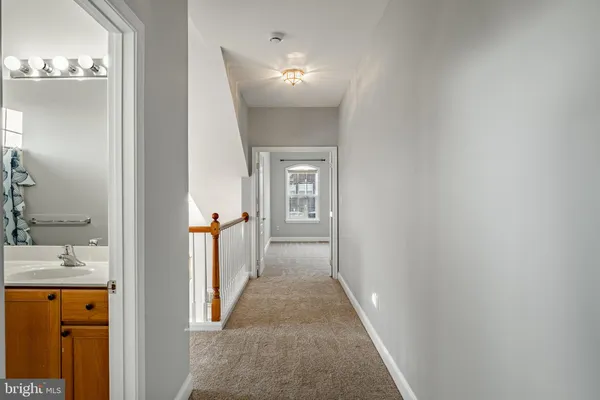 a view of a hallway view with staircase