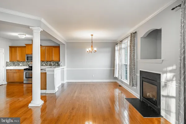 a kitchen with stainless steel appliances a refrigerator and a stove top oven