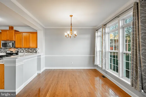 a living room with a fireplace and a large window