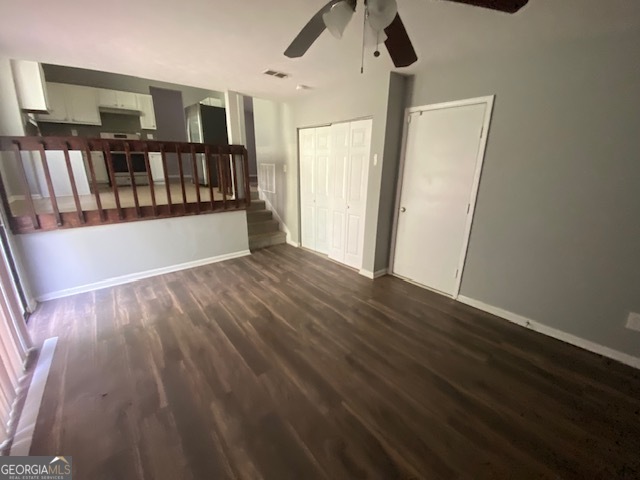 5389 Martins Crossing Road Stone Mountain, GA 30088 - Photo 12 of 30 a view of an empty room with wooden floor