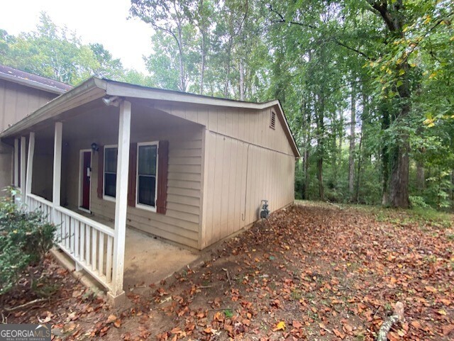 5389 Martins Crossing Road Stone Mountain, GA 30088 - Photo 27 of 30 a view of a house with a small yard