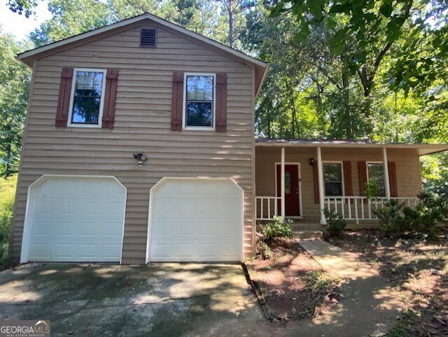 5389 Martins Crossing Road Stone Mountain, GA 30088 - Photo 30 of 30 front view of a house with a yard