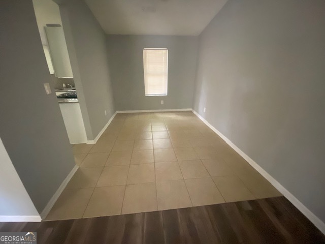 5389 Martins Crossing Road Stone Mountain, GA 30088 - Photo 5 of 30 a view of an empty room with a window