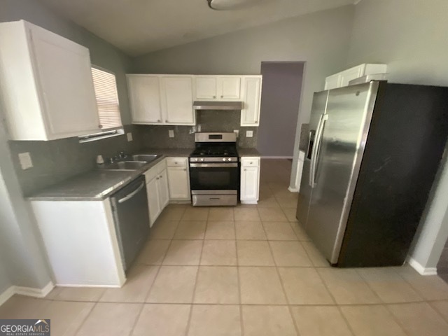 5389 Martins Crossing Road Stone Mountain, GA 30088 - Photo 7 of 30 a kitchen with a stove a refrigerator and a sink