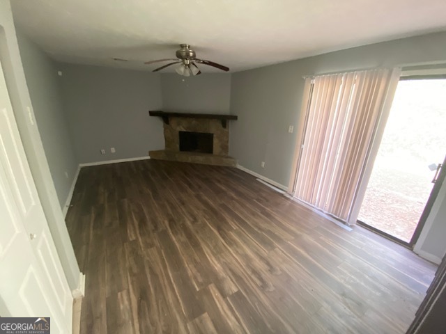 5389 Martins Crossing Road Stone Mountain, GA 30088 - Photo 10 of 30 a view of empty room with wooden floor and fan