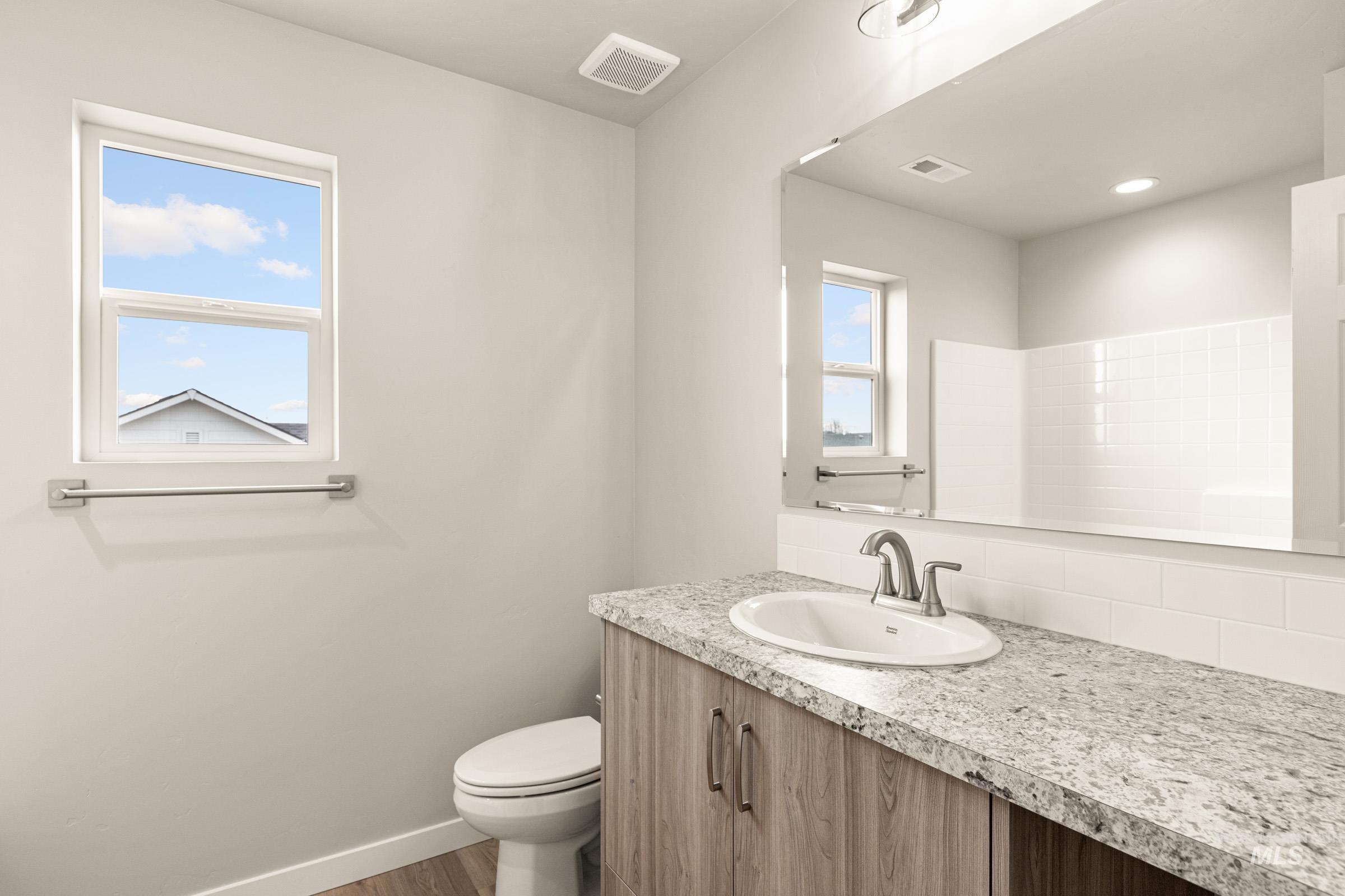 13686 Inman Court Caldwell, ID 83607 - Photo 16 of 20 Bathroom featuring vanity and wood finished floors